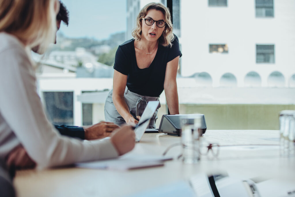 Woman explaining new strategies to her team